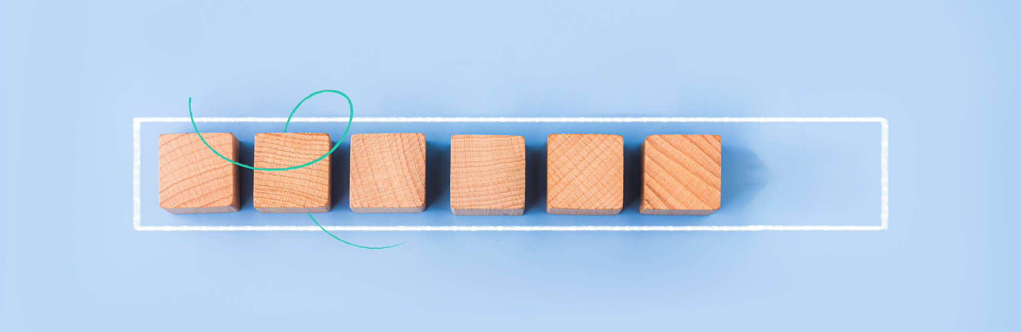 Wooden block cubes on the baby blue background