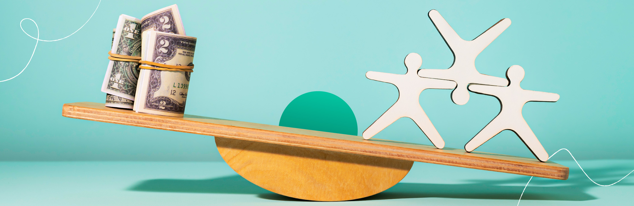 A wooden balance board with people figures and money on the opposite sides